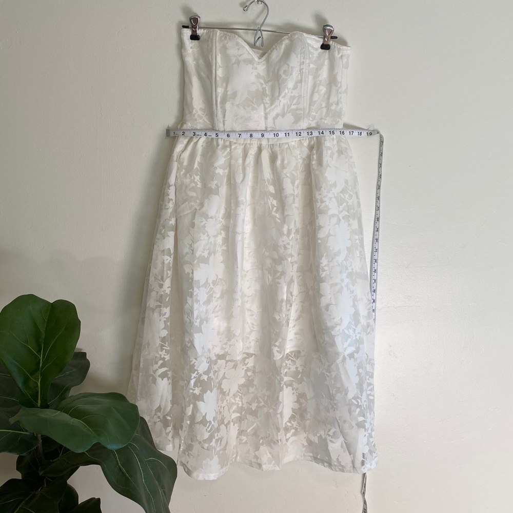 Strapless white dress with transparent layer